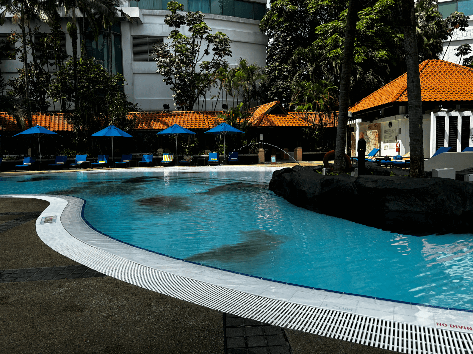 Hotel swimming pool showing discoloured water caused by a pool circulation issue
