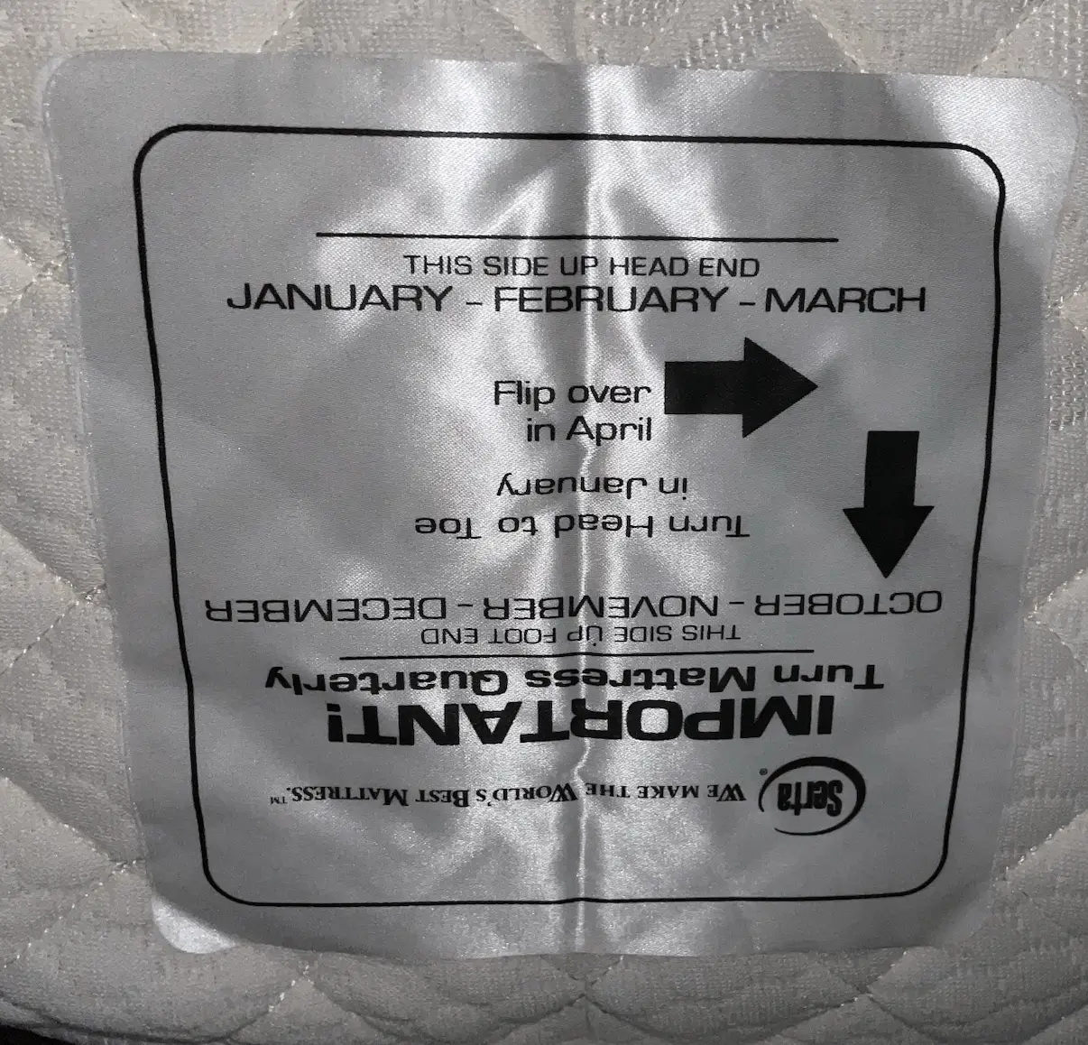 Mattress rotation label shown upside down highlighting a hotel room quality issue