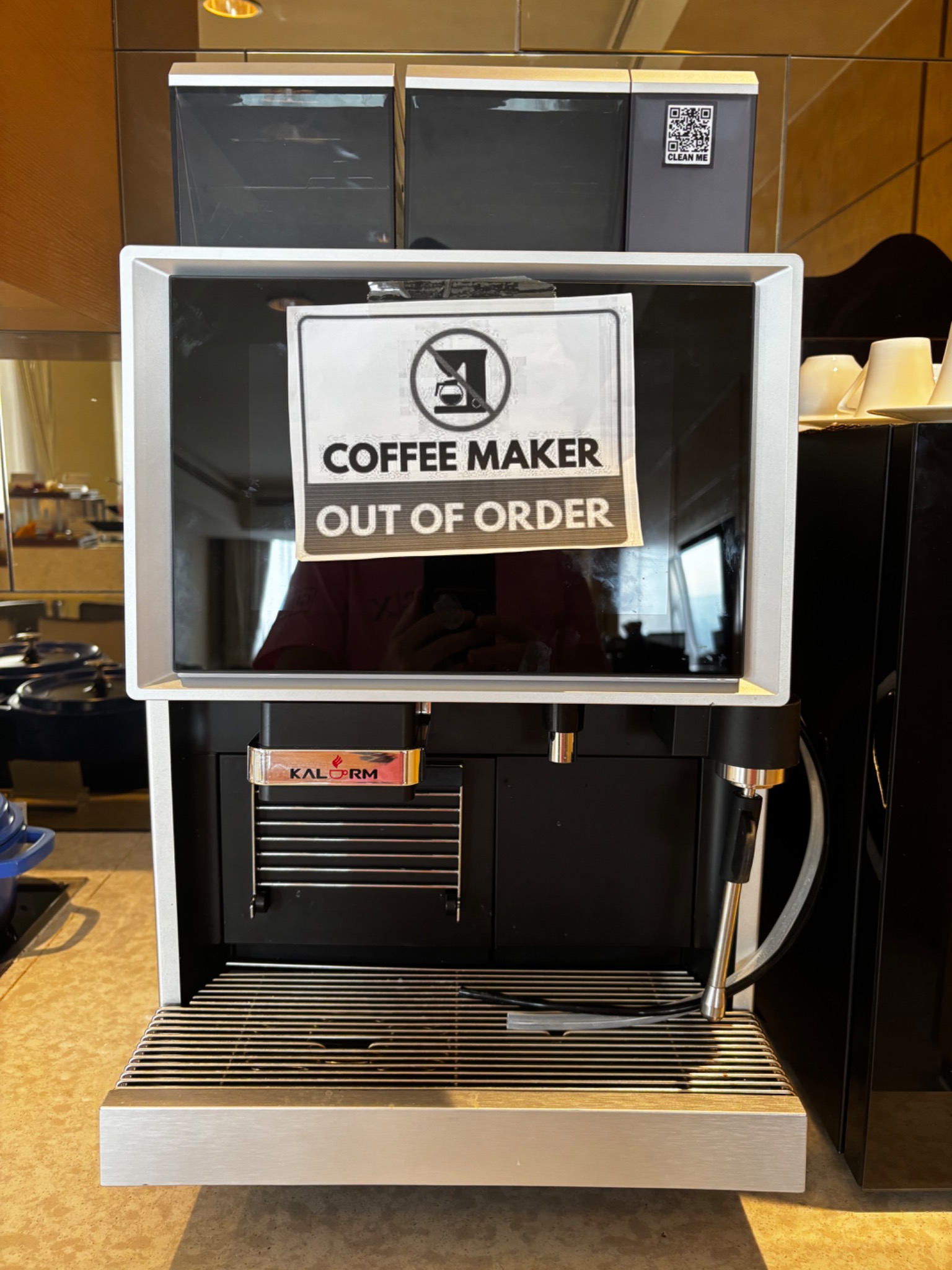 Executive lounge coffee machine with an out of order sign