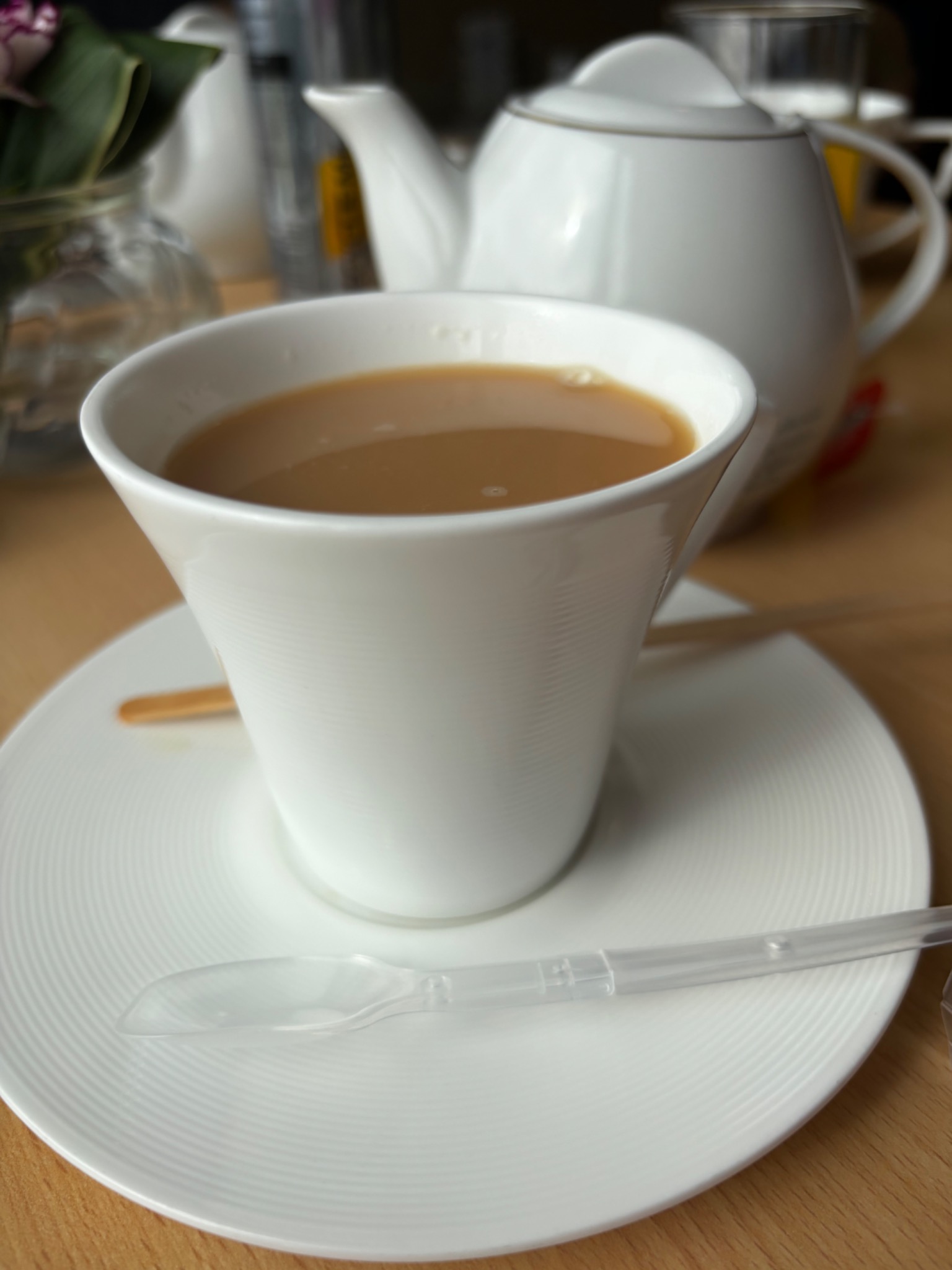 Tea service in an executive lounge with a disposable stirrer