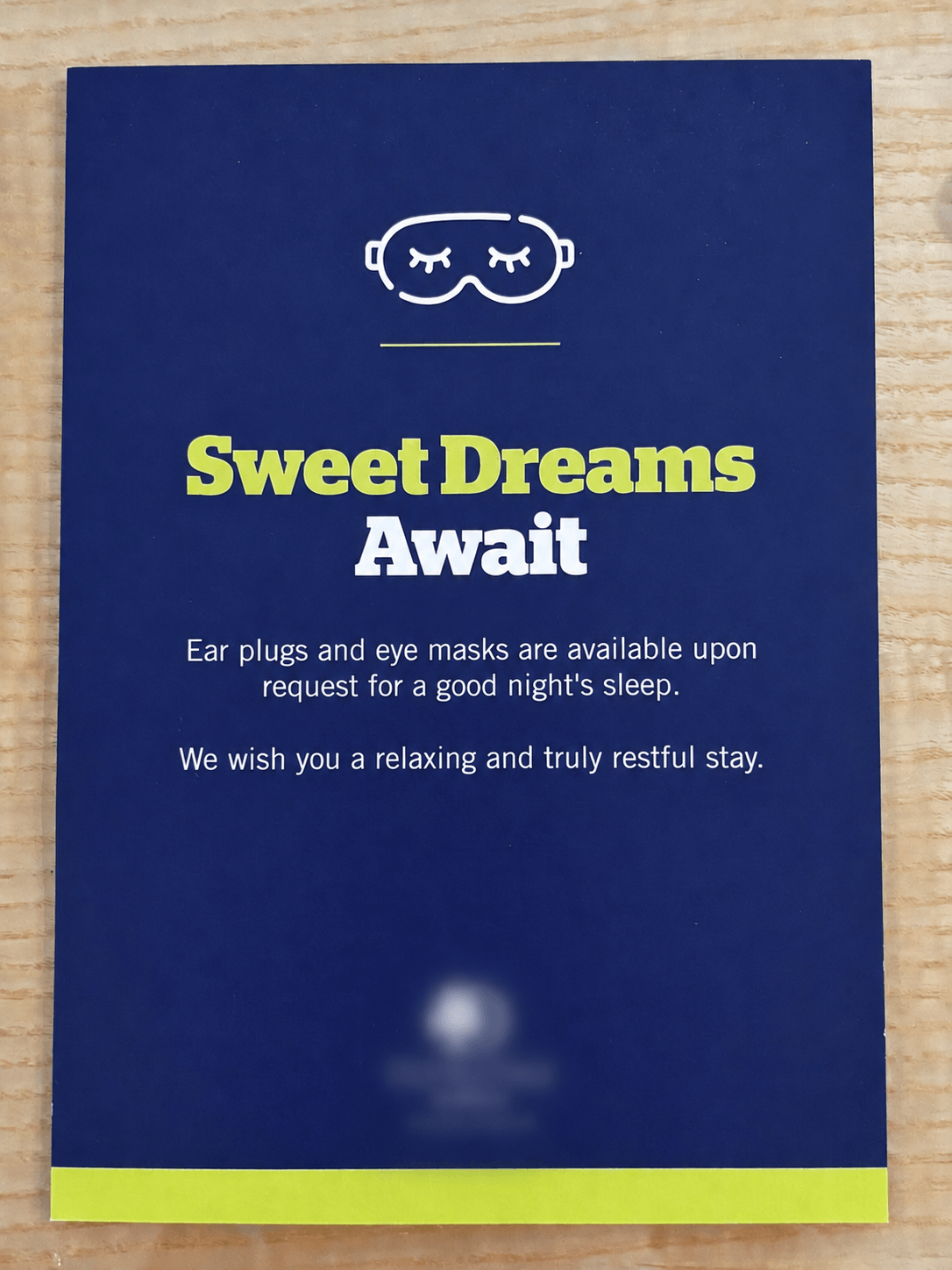 Hotel bedside card offering ear plugs and eye masks for a good night's sleep